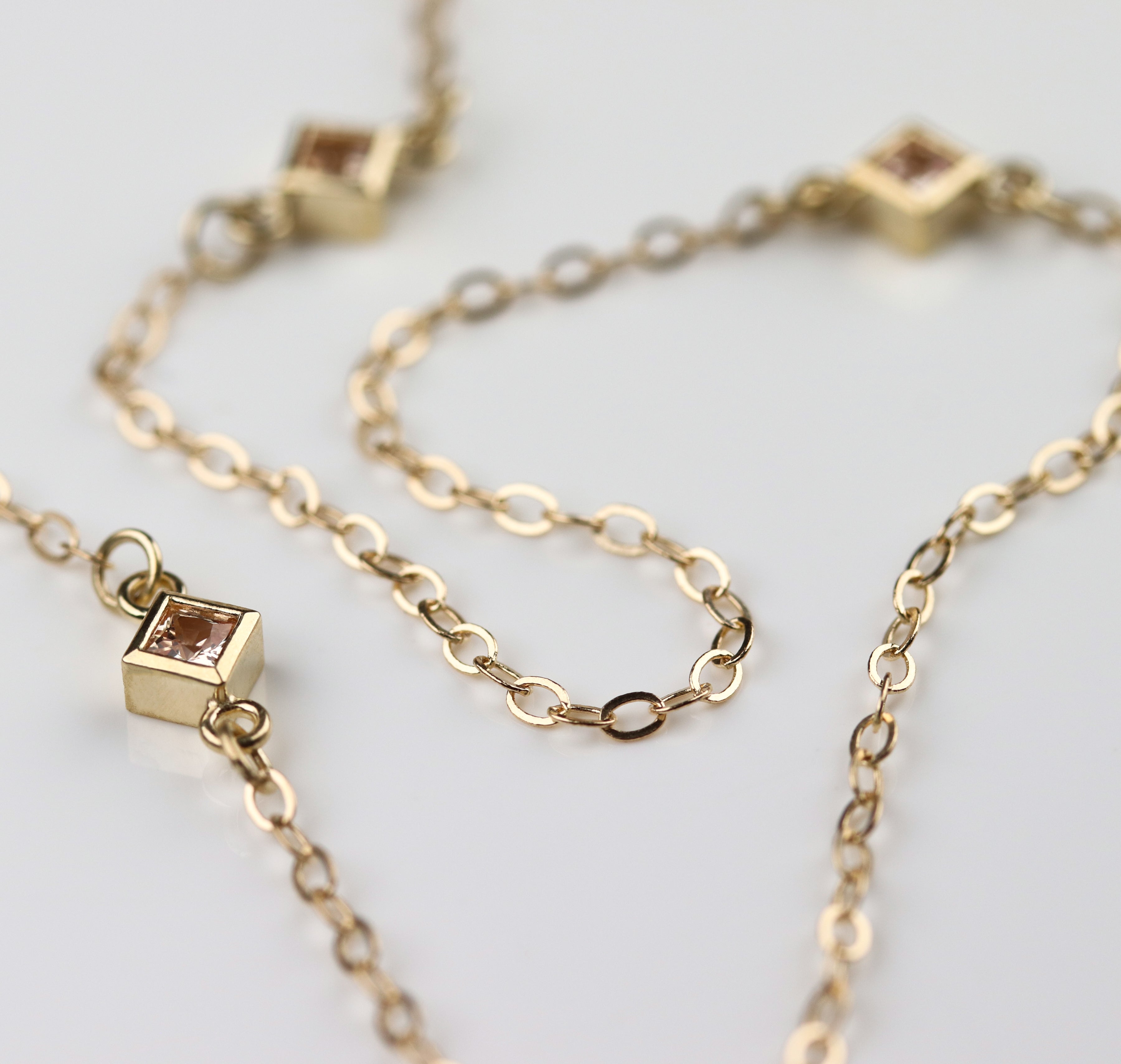 . Princess-cut Peach Sapphire Station Necklace