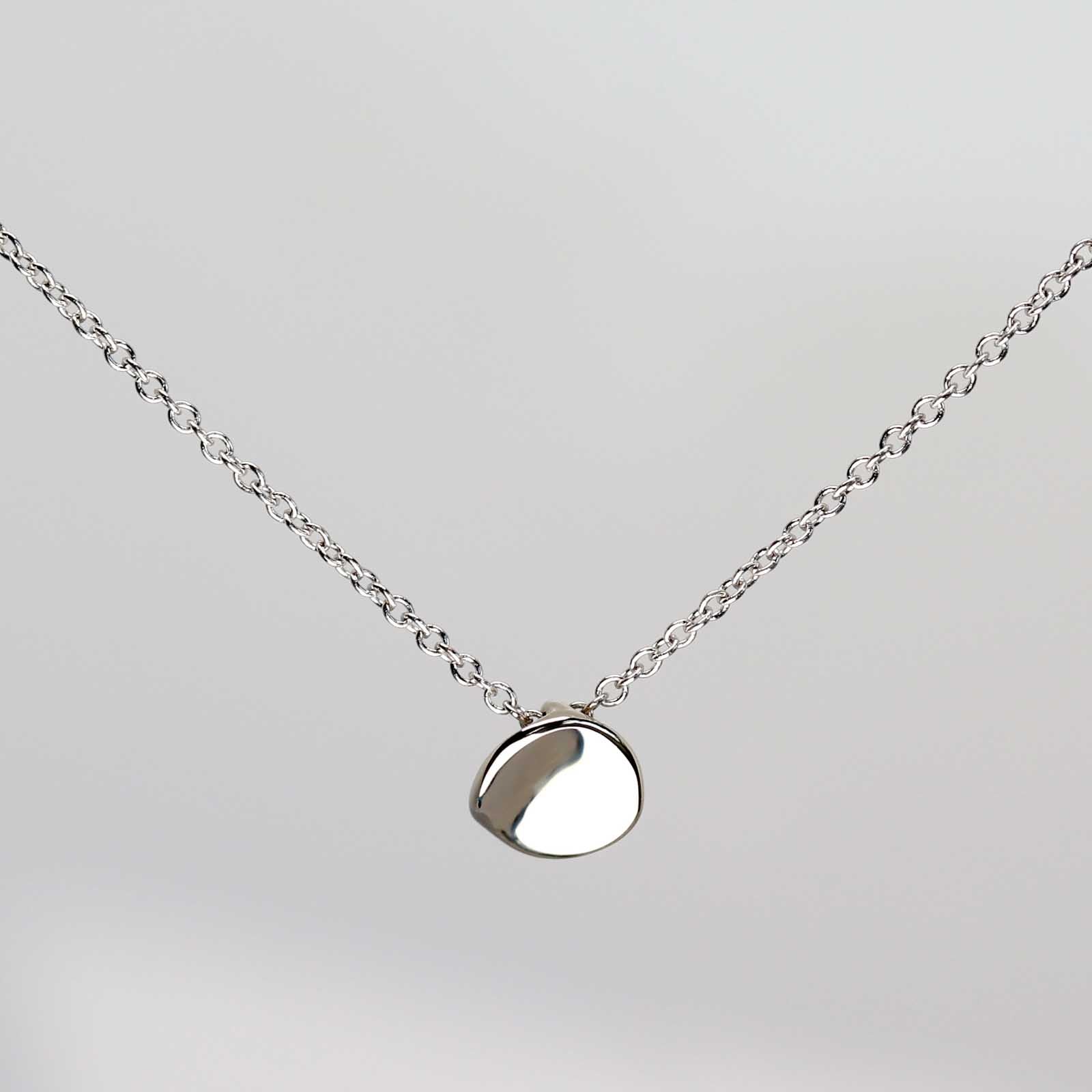 . Small Sculpted Disc Pendant