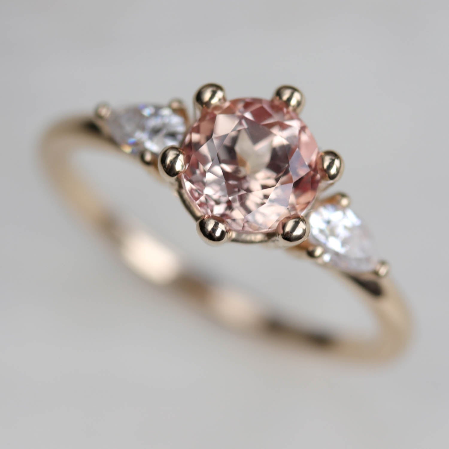 Prong-set Three Stone Ring with Pear-Shaped Side Stones