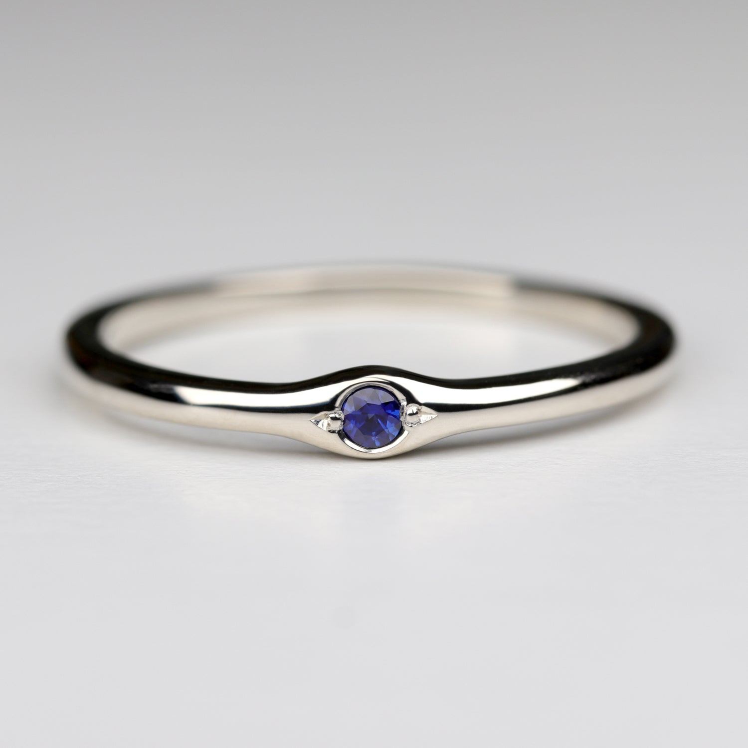 2mm Bump Ring with a Dark Blue Sapphire