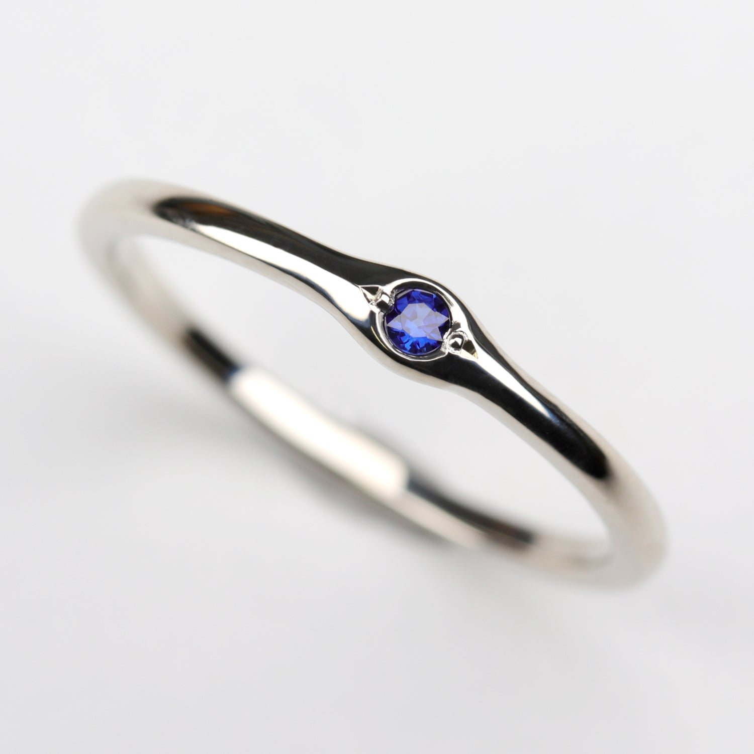 2mm Bump Ring with a Dark Blue Sapphire