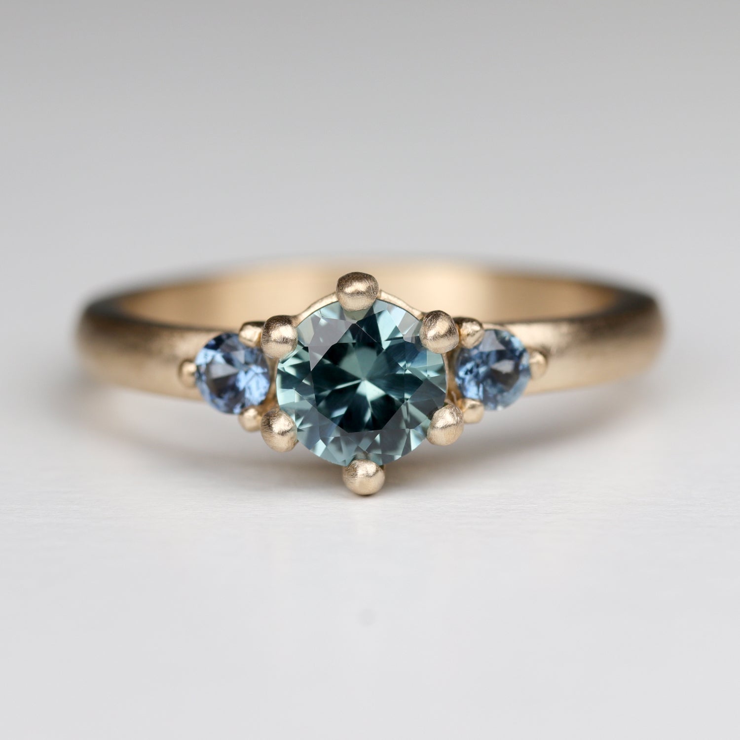5mm Prong Set Three Stone Ring with Montana Sapphire