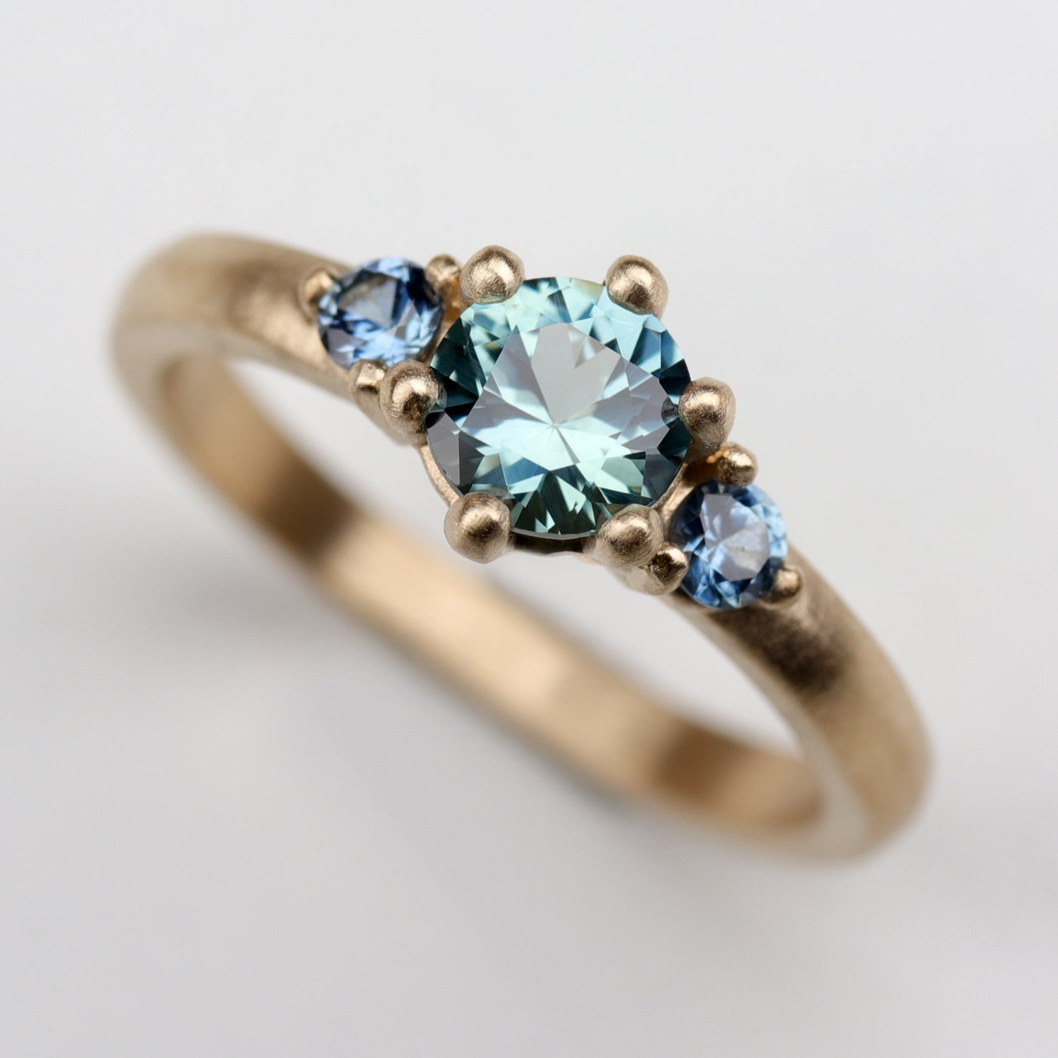 5mm Prong Set Three Stone Ring with Montana Sapphire