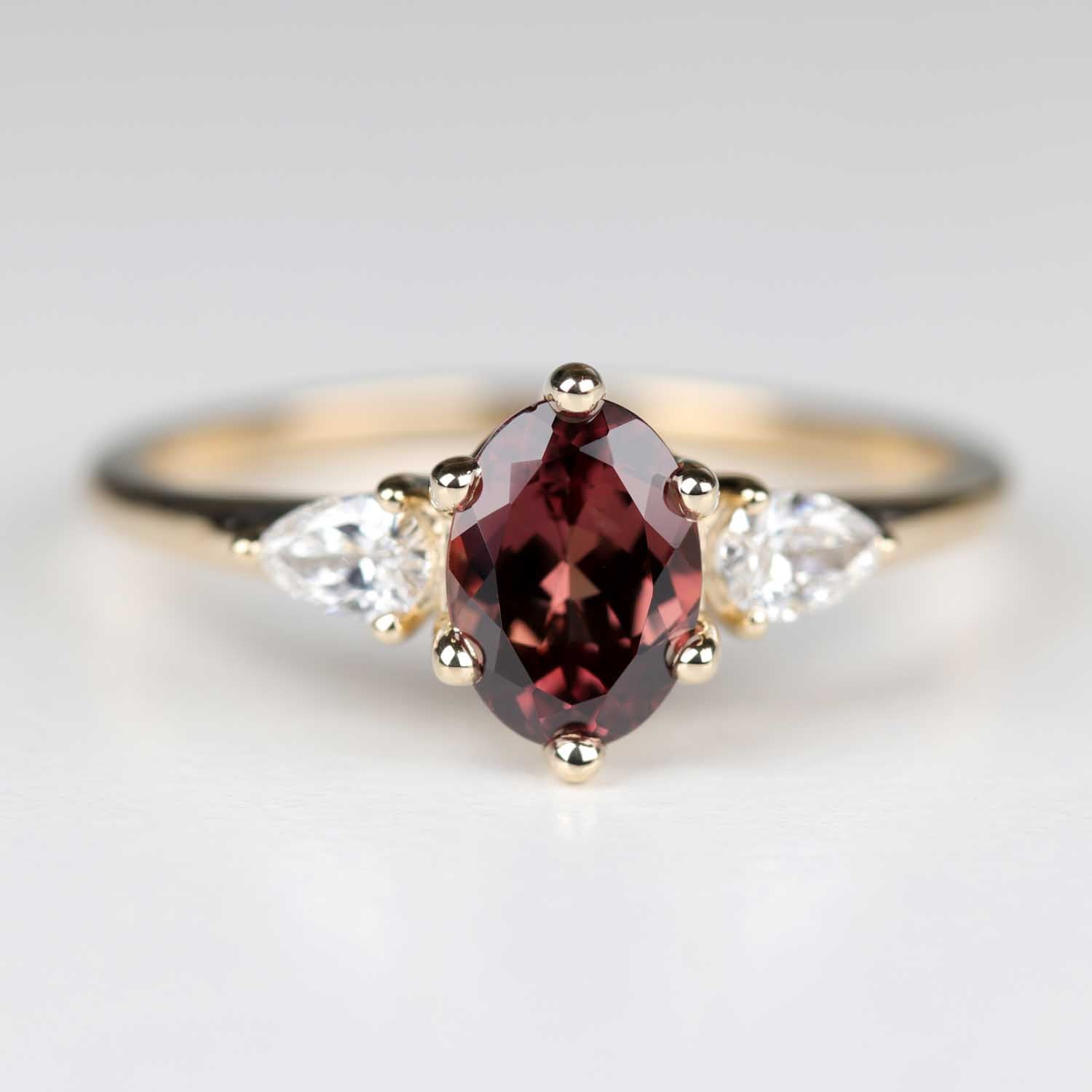 7x5mm Burgundy Sapphire Three Stone Engagement Ring