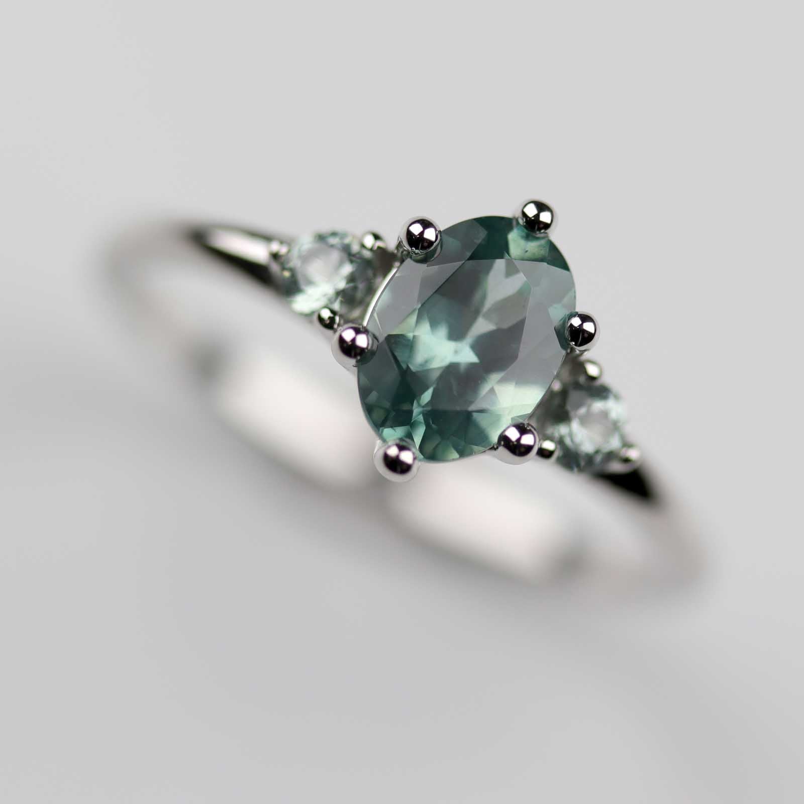 7x5mm Oval Teal Sapphire Three Stone Platinum Ring