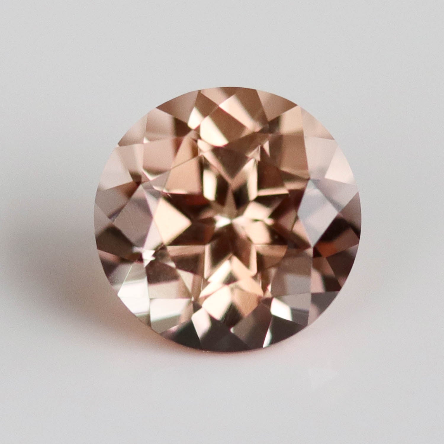 . Lab-grown Peach Champagne Sapphire