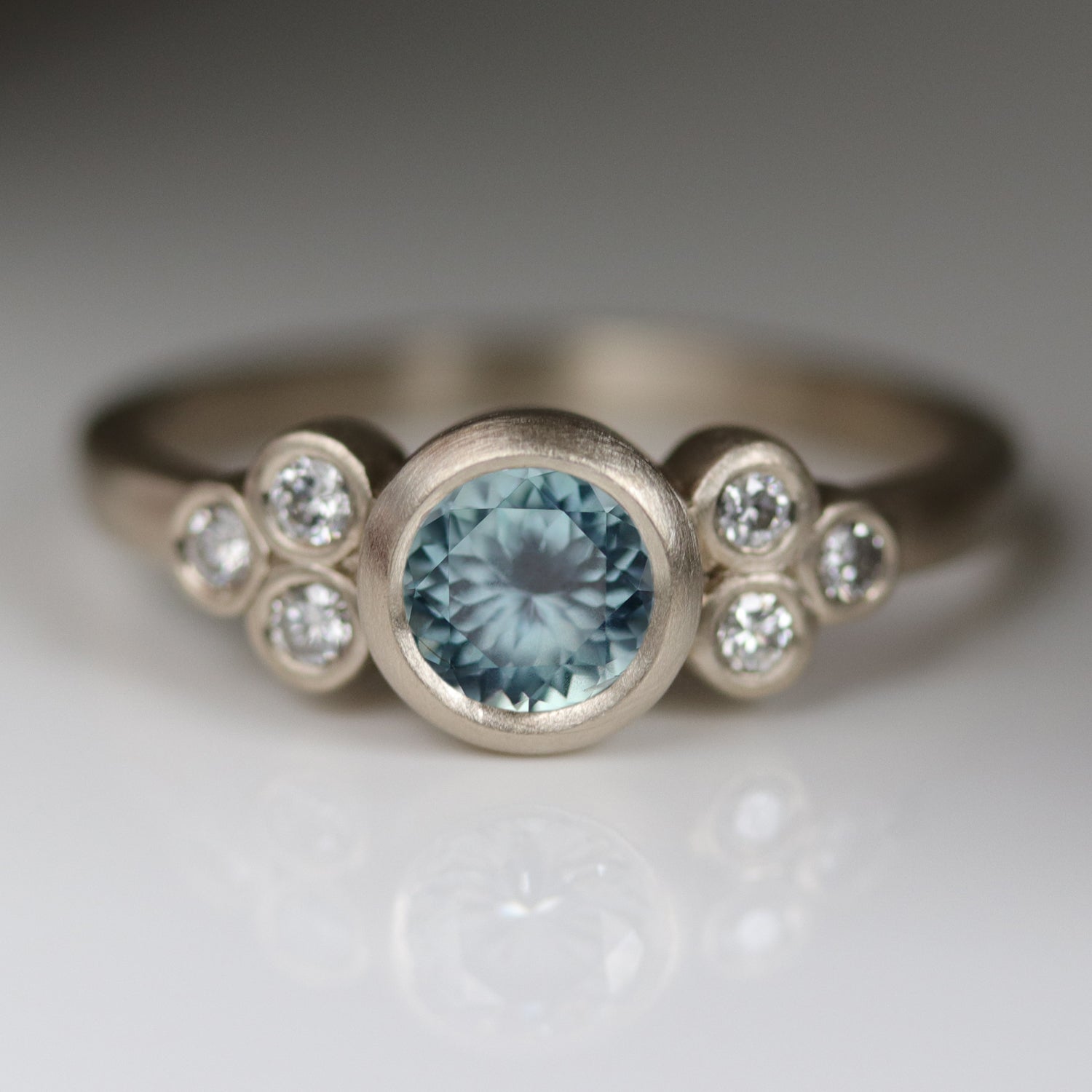 Seven Stone Cluster Ring with Montana Sapphire Center Stone