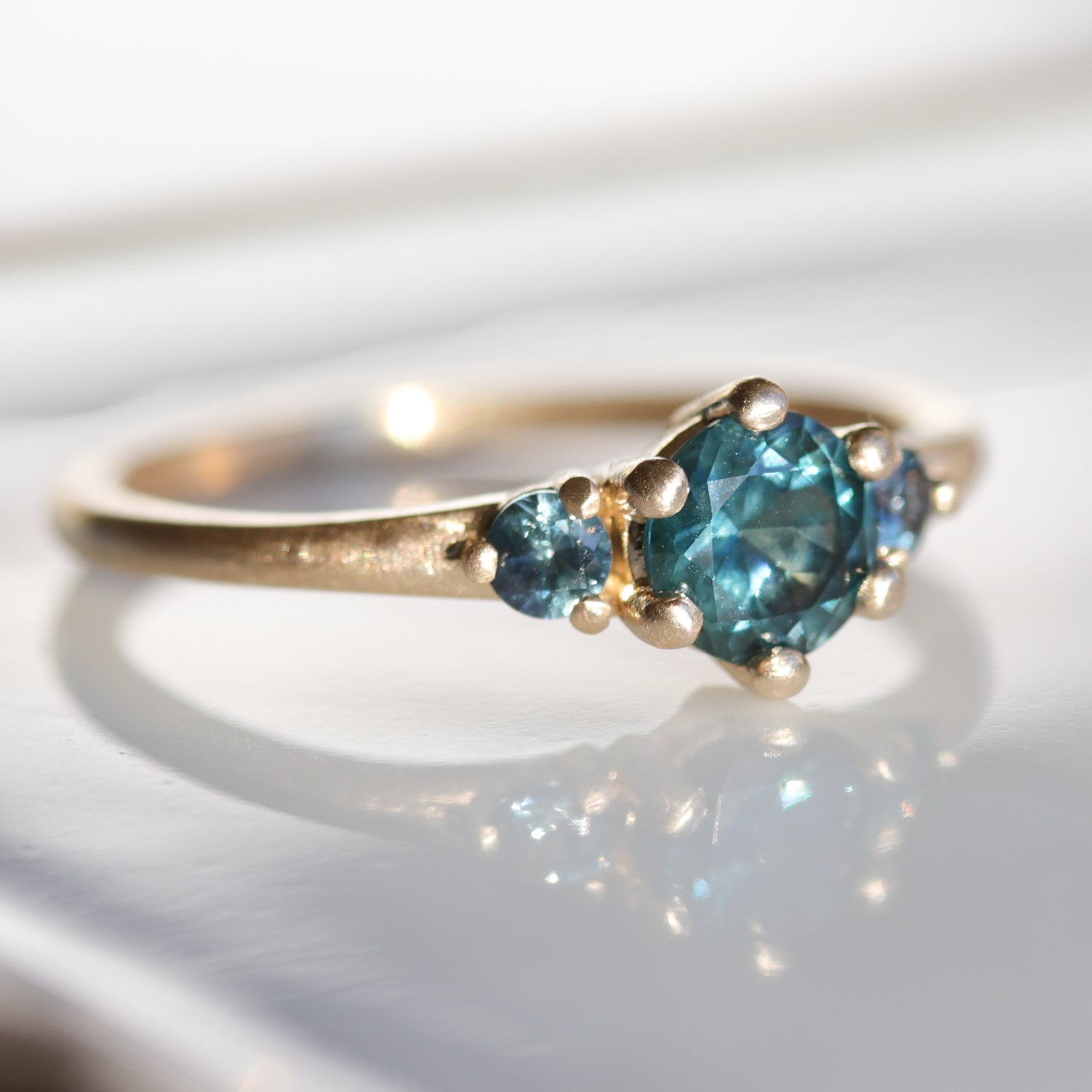 Prong-set Three Stone Ring with Montana Sapphires
