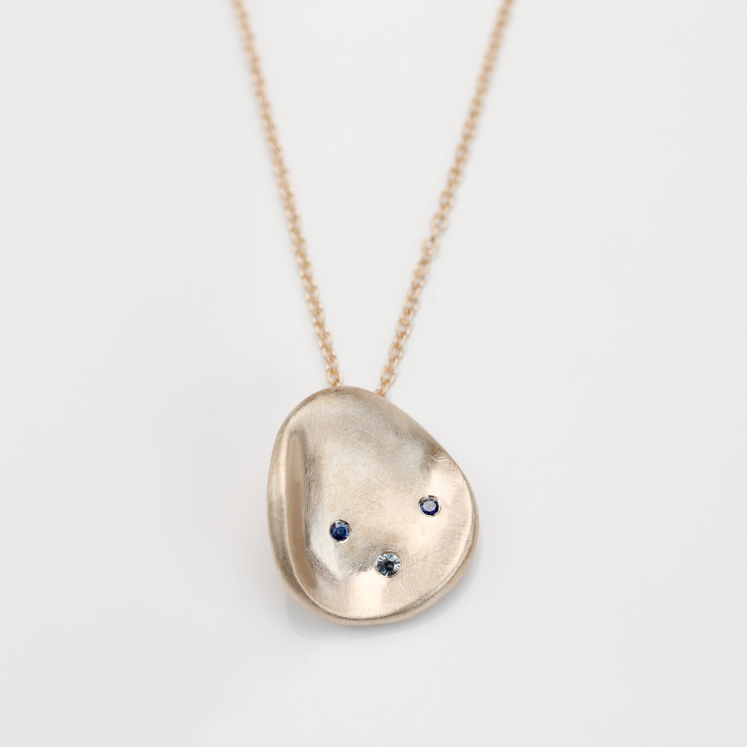 Large Sculpted Disc Pendant with Sapphires & Hand Engraving