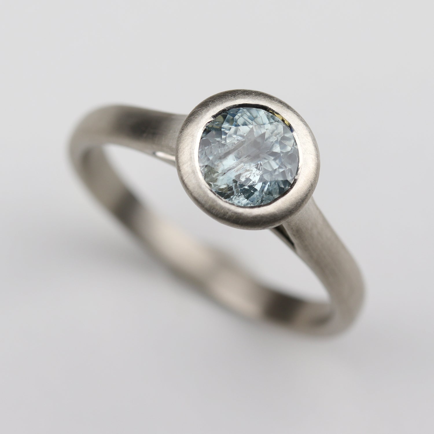 Open Bezel Solitaire Engagement Ring with a Montana Sapphire