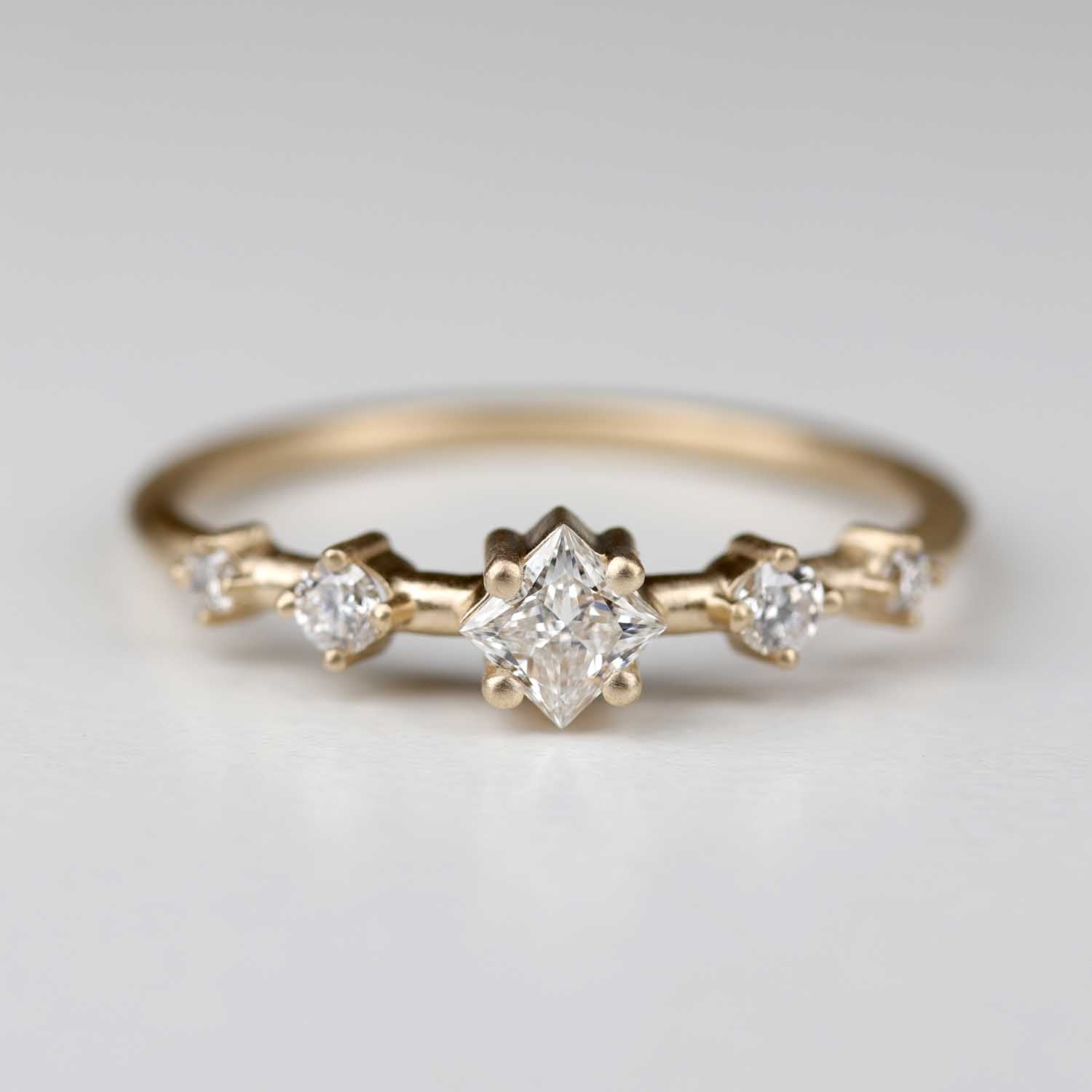 . Princess Cut Station Ring