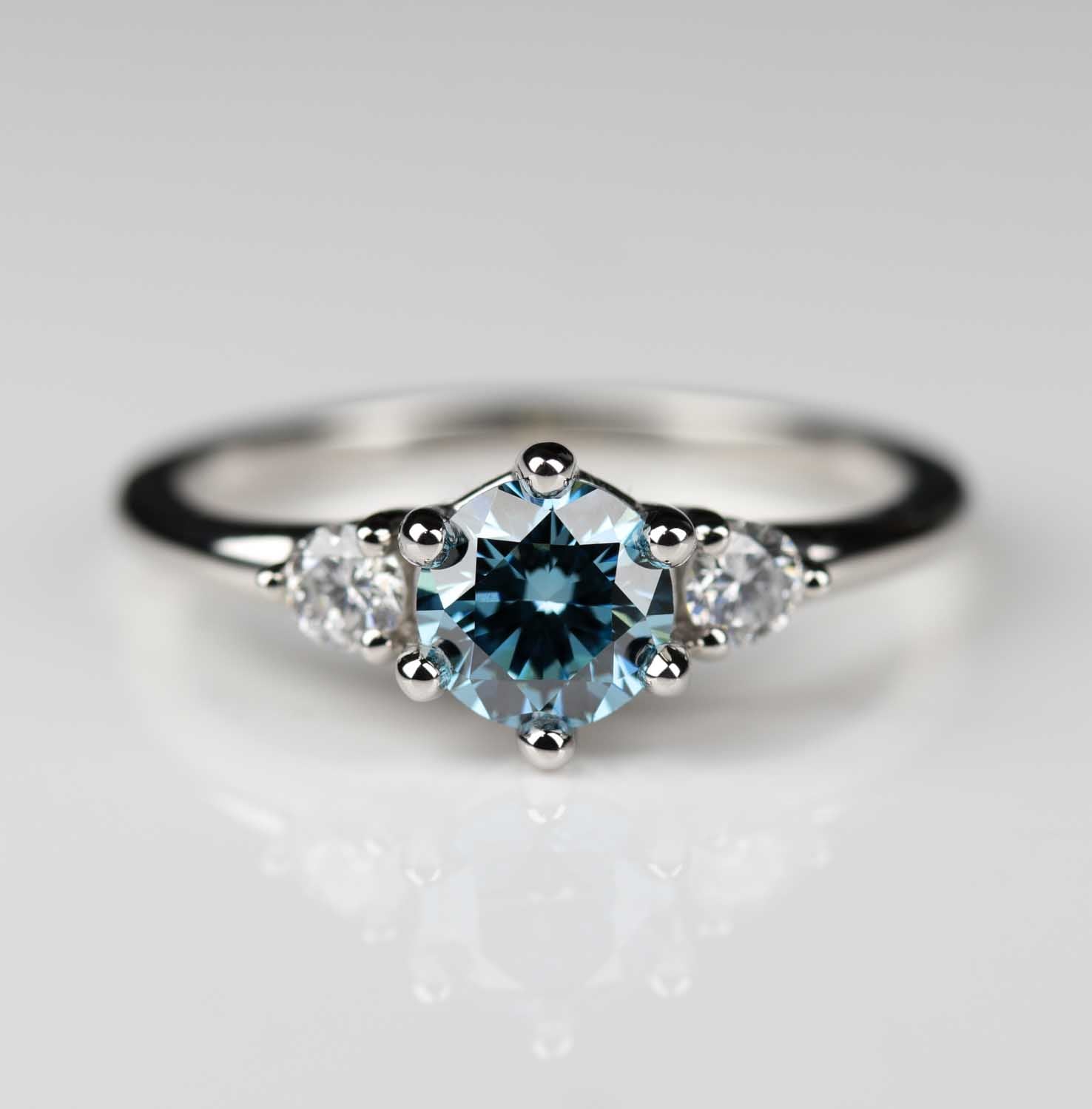 Three Stone Ring with Lab-grown Vivid Fancy Blue Diamond in Platinum