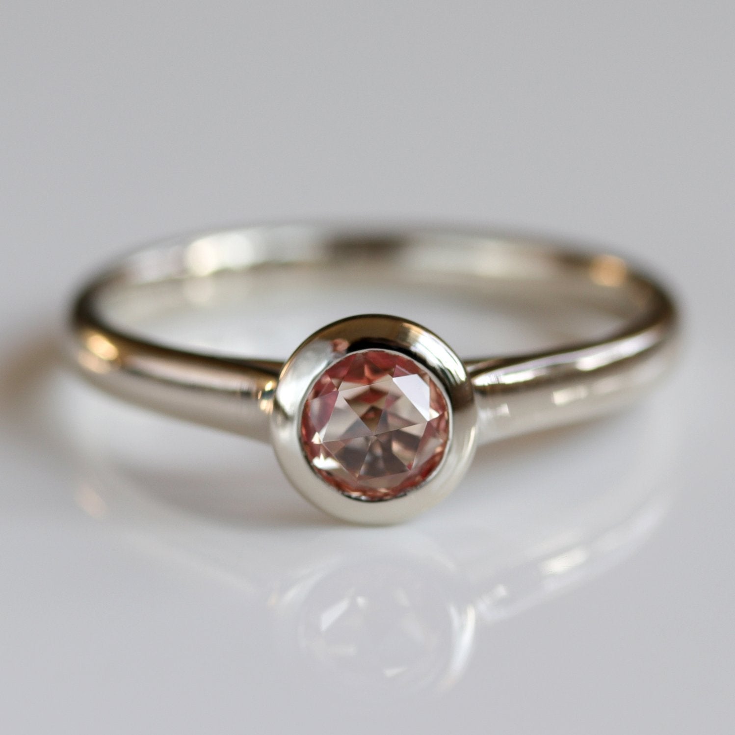 . Lab-grown Peach Champagne Sapphire