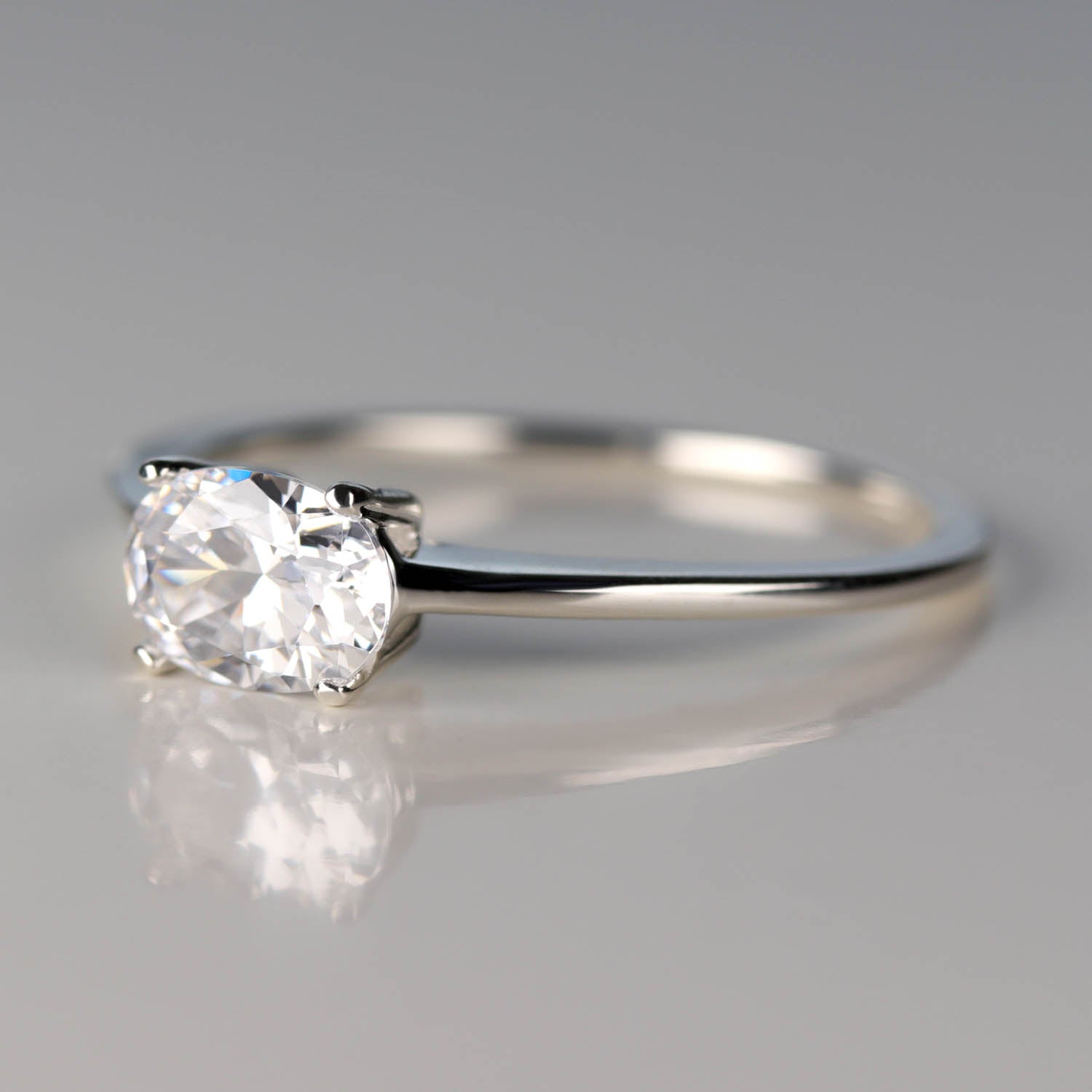 Oval Cut East-West Basket Solitaire Engagement Ring