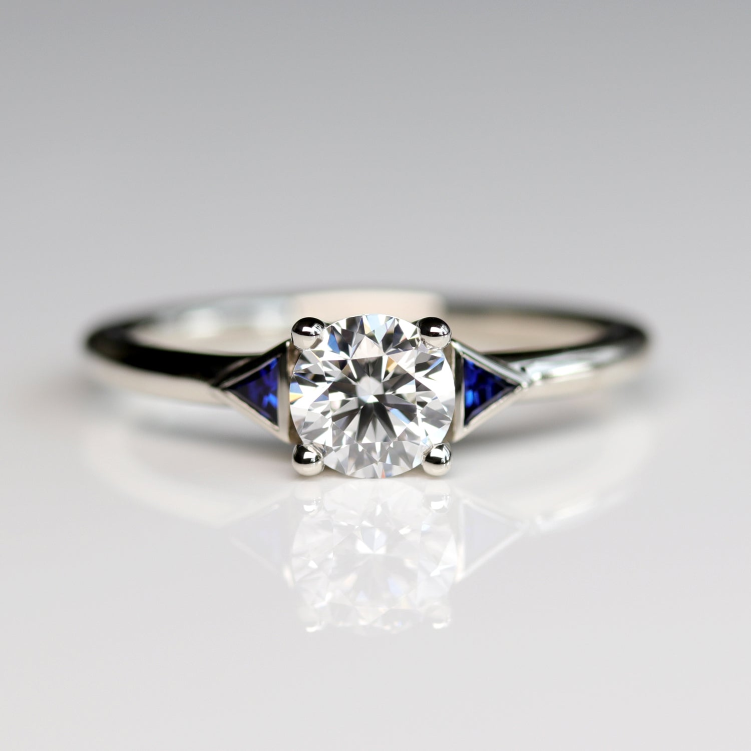 Prong-set Deco Three Stone Ring with Blue Sapphire Side Stones