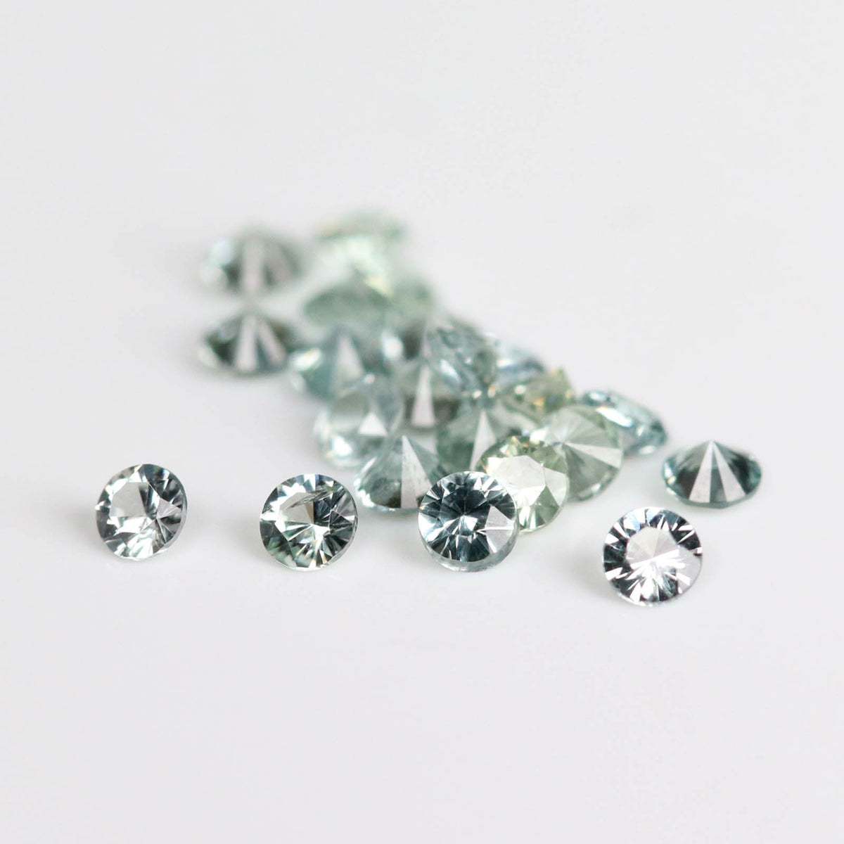 1.5mm Round Light Green Montana Sapphires - 115315