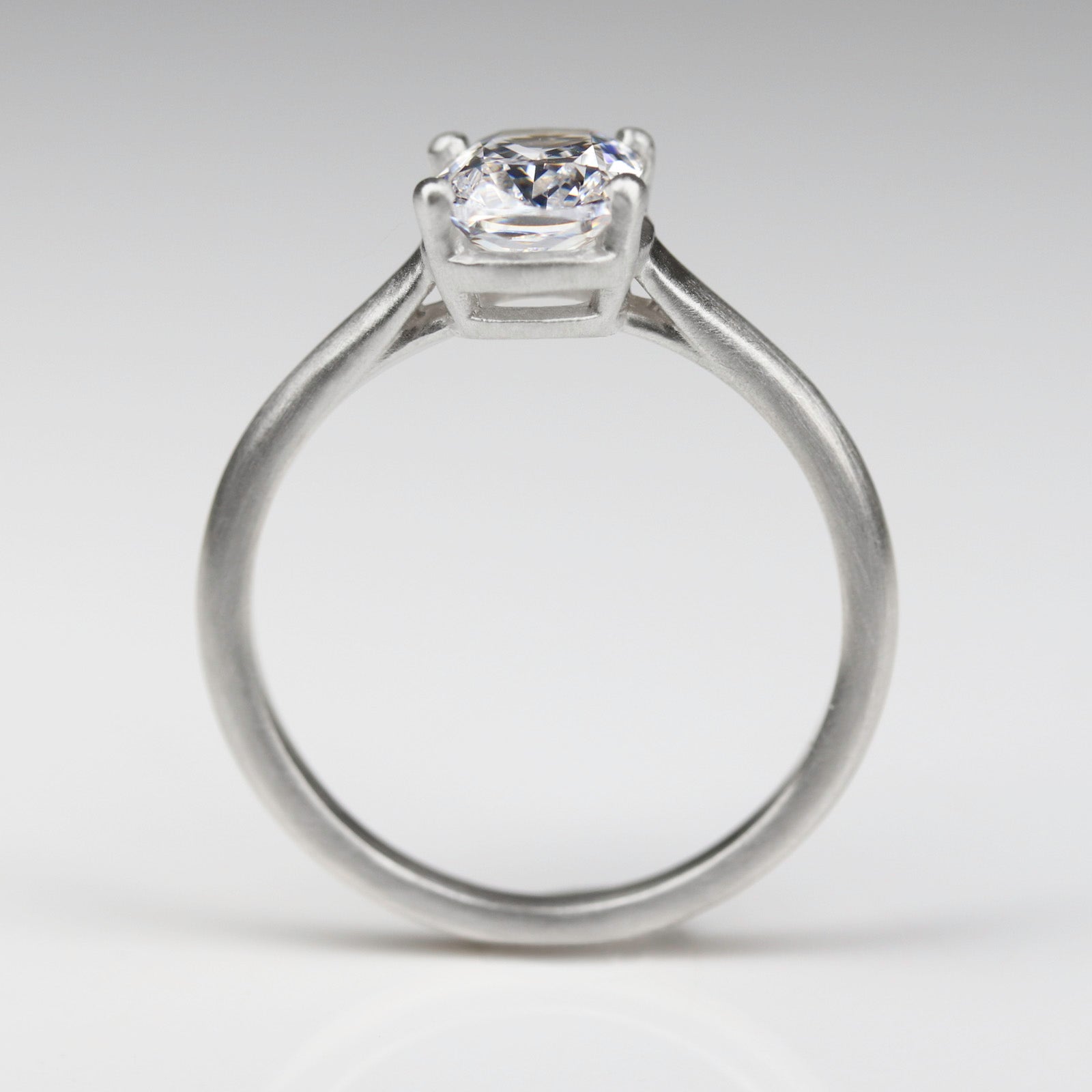 vintage style cathedral solitaire engagement ring in platinum with elongated cushion-cut lab diamond
