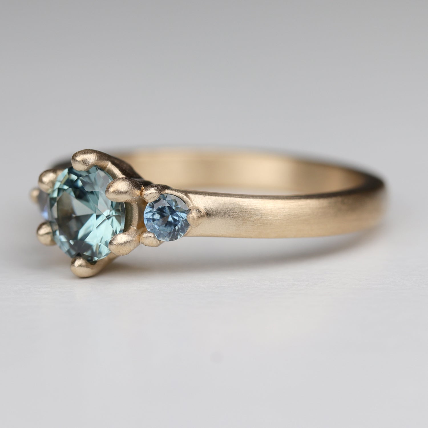 5mm Prong Set Three Stone Ring with Montana Sapphire