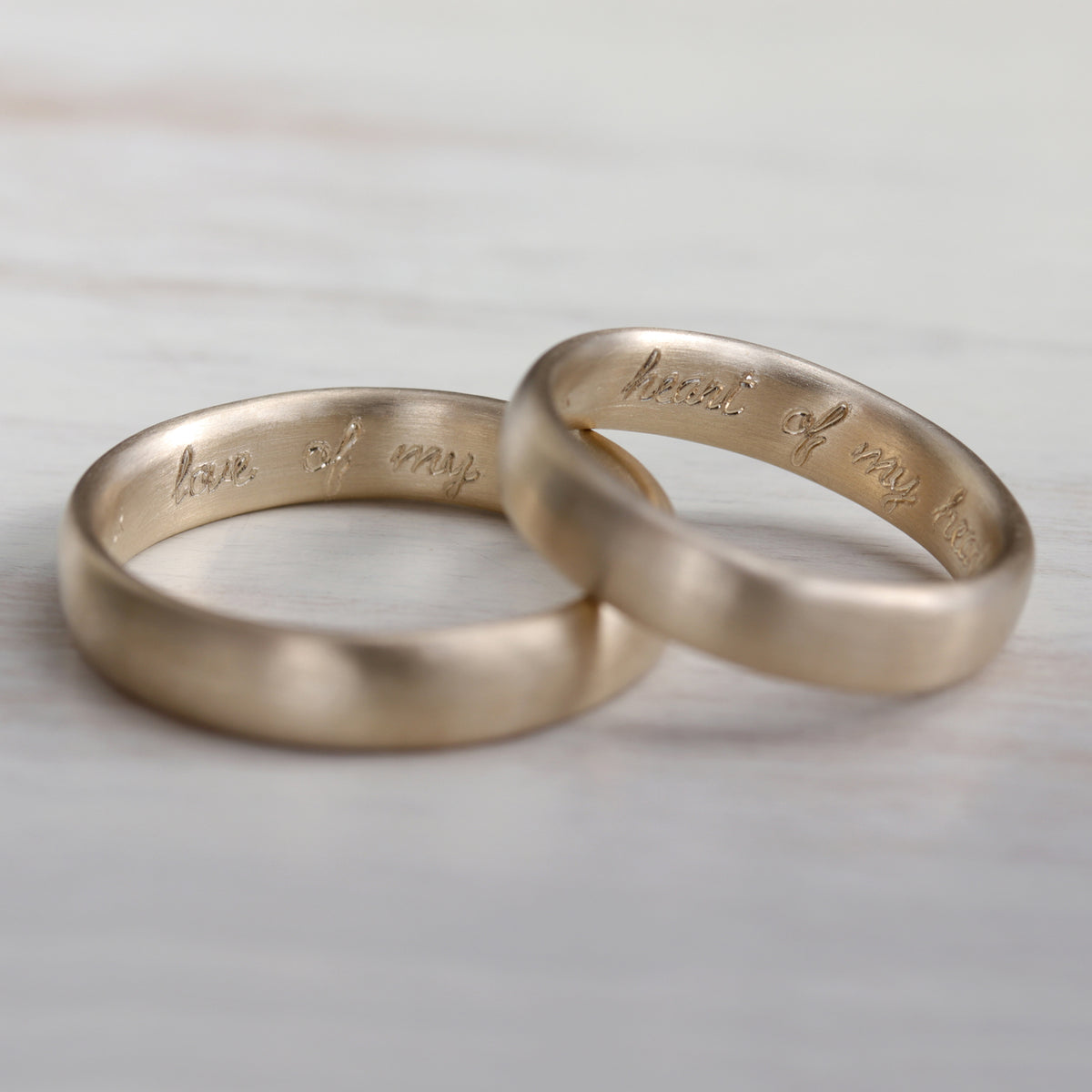 My wife was in charge of getting our wedding rings engraved : r/aww