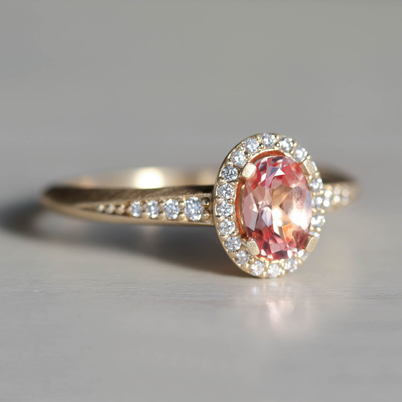 Oval Halo Solitaire with Peach Champagne Sapphire and Diamonds